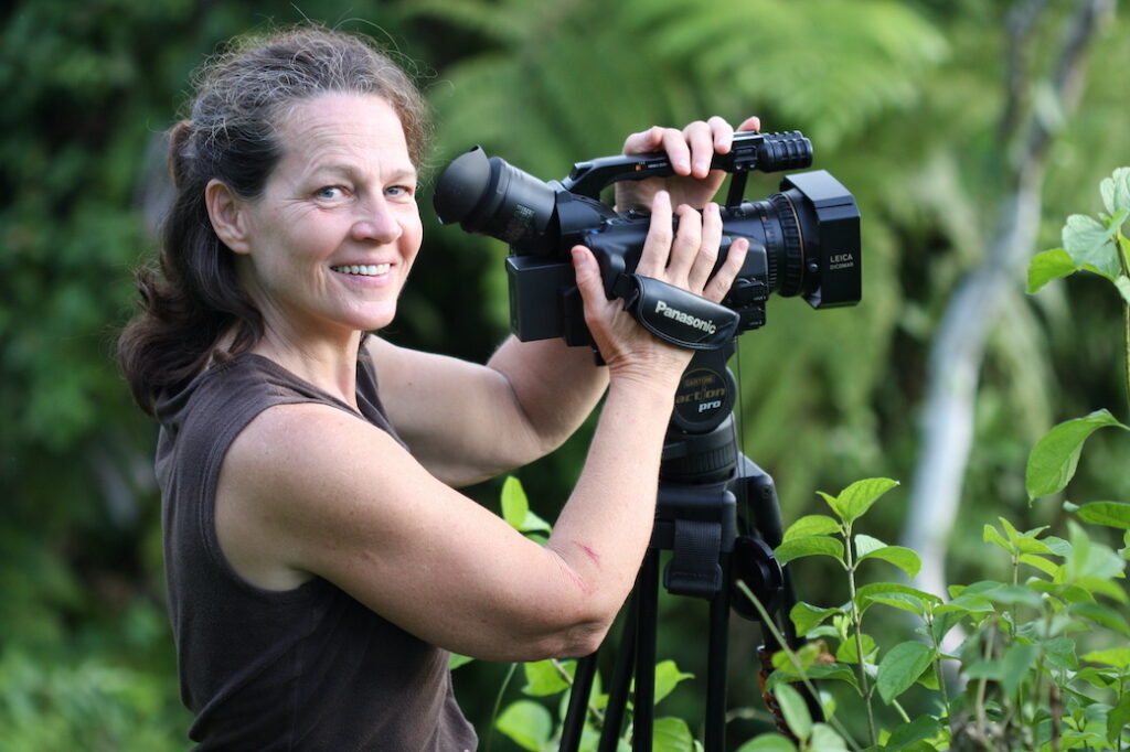 Vegan Storyteller Jeanette McDermott in Costa Rica filming with a video camera