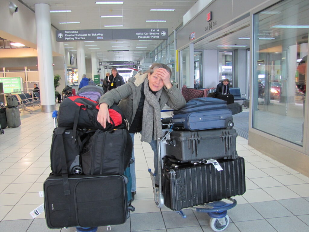 woman in airport with luggage