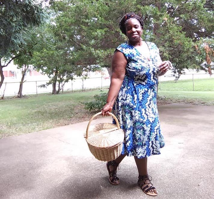 Going Vegan for Lent - Sharon Bolden dressed in a flora blue dress carrying a wickera basket