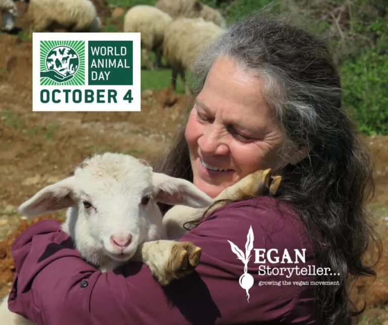 Vegan Storyteller Jeanette McDermott holding a lamb for World Animal Day