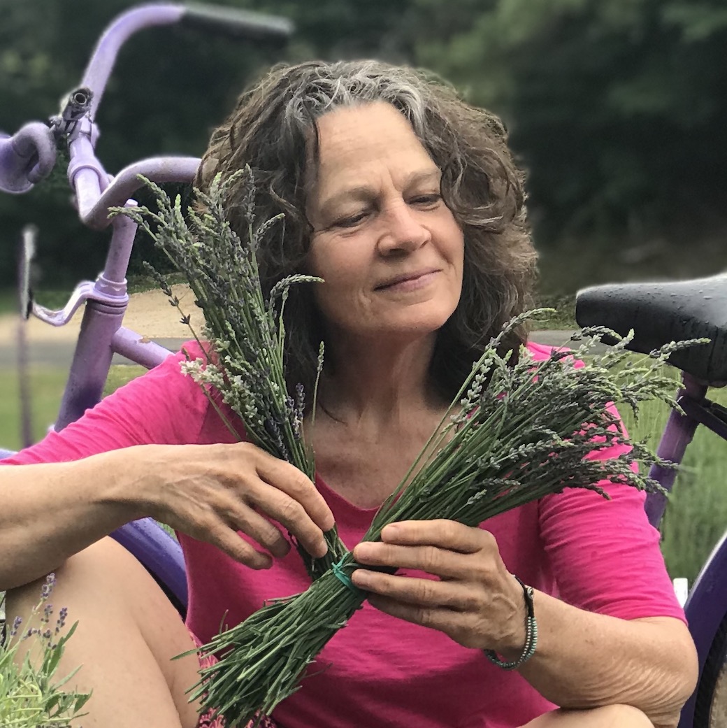 Vegan Storyteller Jeanette McDermott contemplating going from vegetarian to vegan while looking at lavender