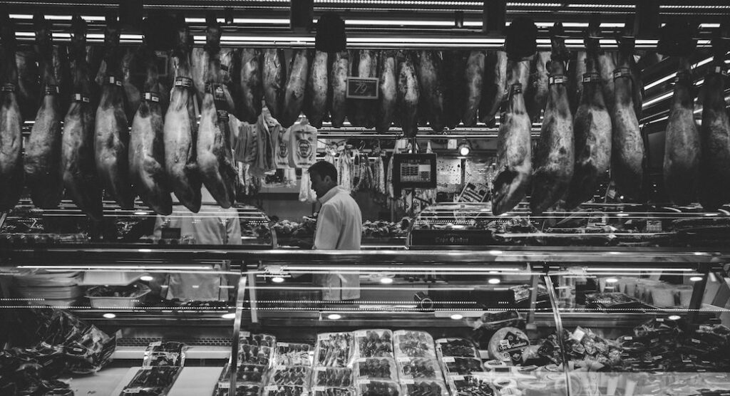 B&W photo of meat counter