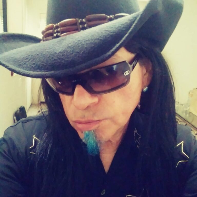 Musician Raven Blackwing wearing black hat