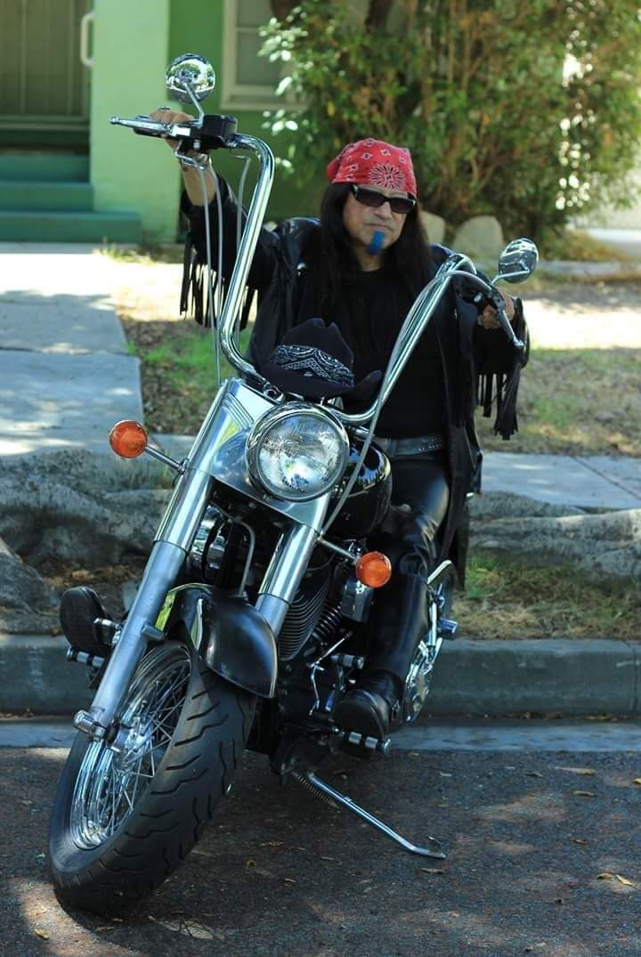musician Raven Blackwing on motorcycle