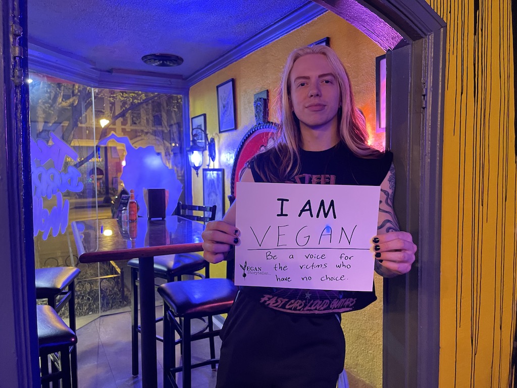 I Am Roman-young man holding I Am sign